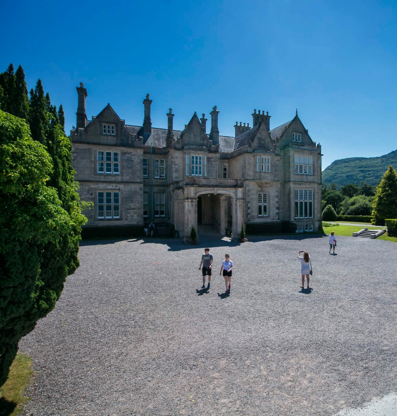 People outside Muckross House and Gardens, Killarney National Park in County Kerry.